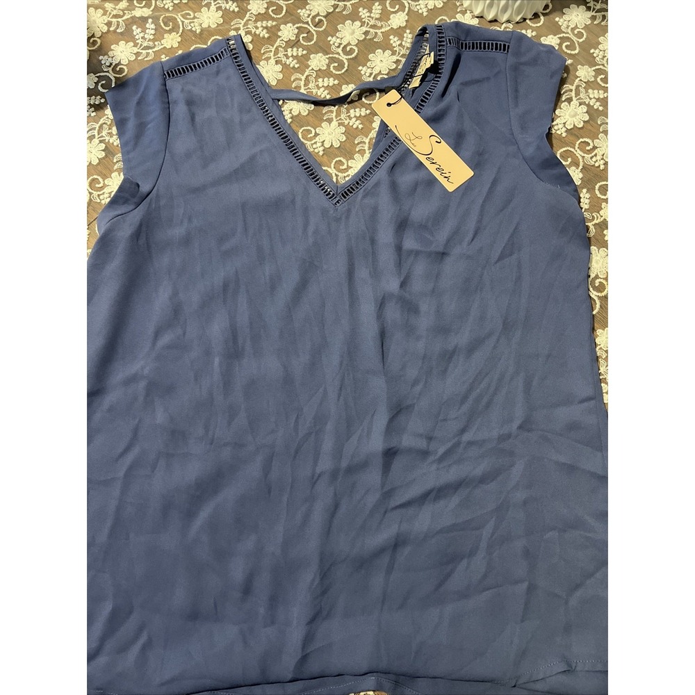 Se Derein blue V neck blouse with criss cross and corcehet style trim M